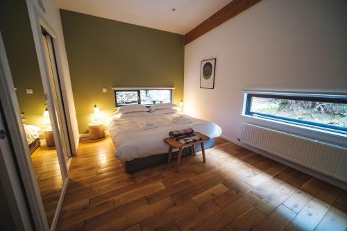 a bedroom with a large bed and a window at Yorkshire Dales Lodge 15 Premium Ensuite in Richmond