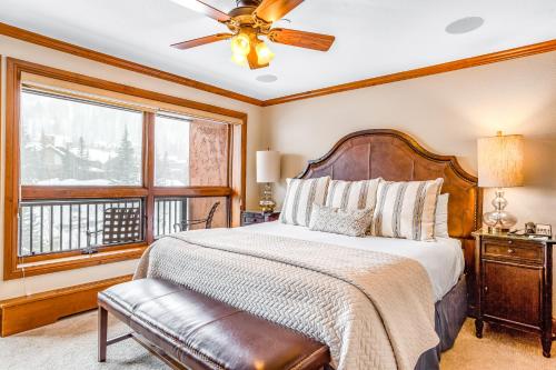 a bedroom with a large bed and a window at Lion Square Lodge South 451 in Vail