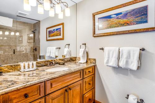 a bathroom with a sink and a mirror at Lion Square Lodge South 451 in Vail