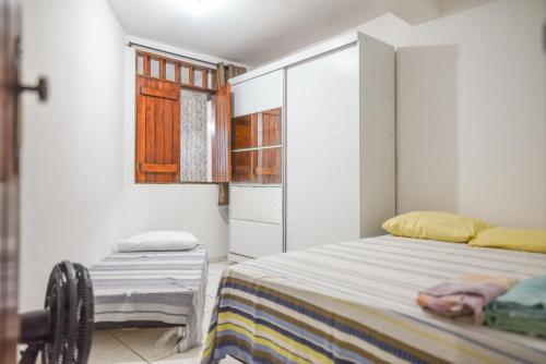 מיטה או מיטות בחדר ב-Casa a 200 m da Praia