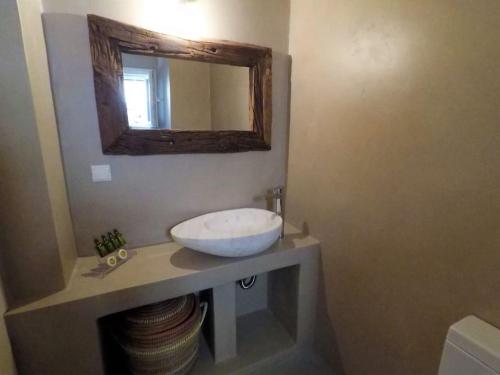 a bathroom with a sink and a mirror on a counter at KVilla Comfort Living in Triandáros