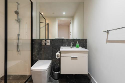 a bathroom with a toilet and a sink and a shower at Fernbank in Dublin