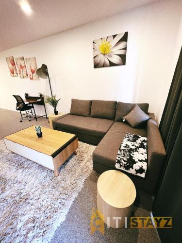 a living room with a couch and a coffee table at Contemporary in Kingston-2bd Apt in Kingston 
