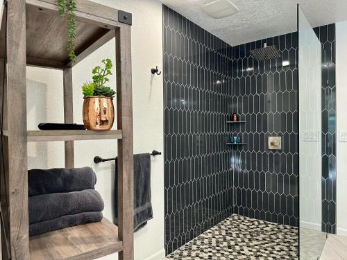 a bathroom with a shower with a glass door at Hilltop Villa, Pool, Hot tub, Views, Avocado Grove in Fallbrook