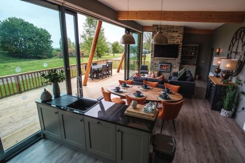 a living room with a view of a deck at Yorkshire Dales Lodge 10 by Together Travel - 3-Bed Ensuite Retreat in Richmond
