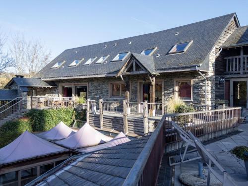 a house with solar panels on the roof of it at Holiday Home in Vielsalm with Garden in Vielsalm