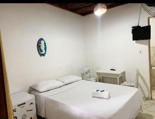 Giường trong phòng chung tại Pousada Quintal da Barra 50 metros do Mar