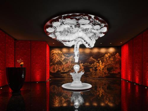 a fountain in the middle of a room with a painting at J Hotel, Shanghai Tower - Above All Else, Overlooking the Bund in Shanghai