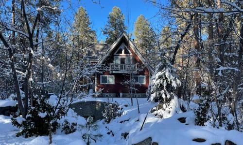 a house in the woods in the snow at Chalet 5 Aspens, Your Exclusive High Country Escape in Prescott