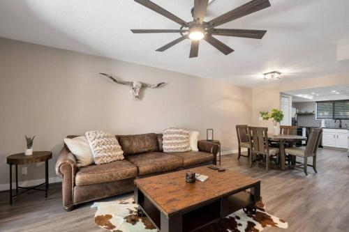 a living room with a couch and a table at Heart of Old Town Scottsdale in Scottsdale