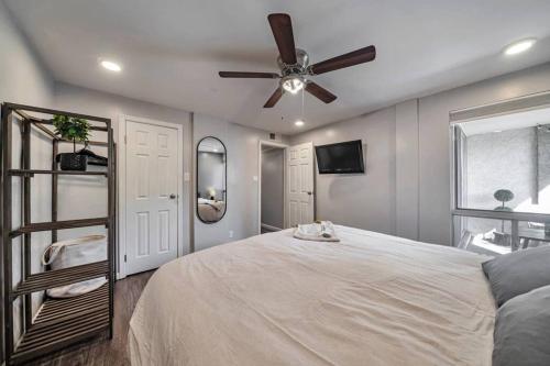 a bedroom with a bed and a ceiling fan at Walk to Old Town Scottsdale in Scottsdale