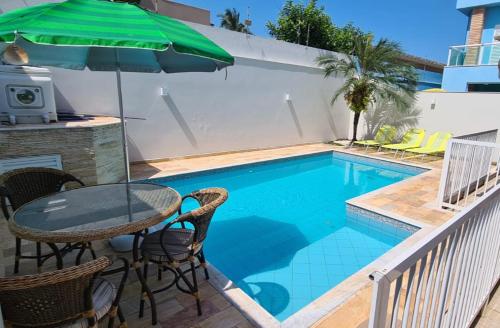 Sobrado com piscina aquecida, frente mar