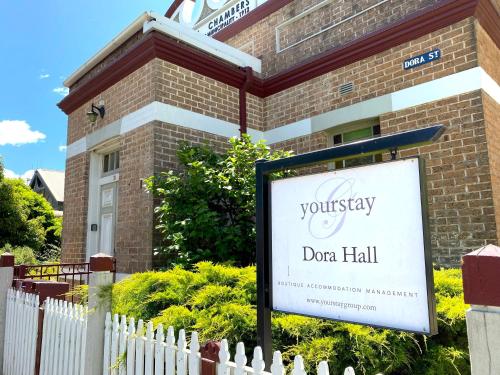 a sign in front of a brick building at Dora Hall - Very Central in Orange