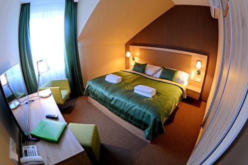 Posteľ alebo postele v izbe v ubytovaní Hotel Stardust