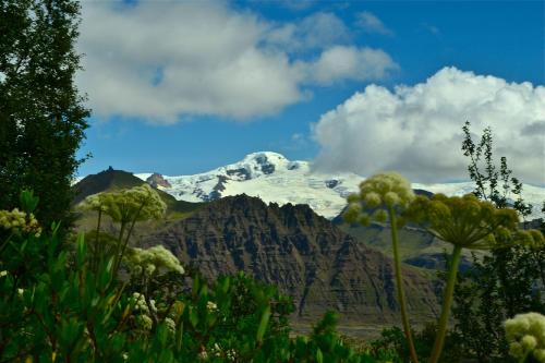 a view of a mountain with snow on it at Árnanes Country Hotel in Höfn