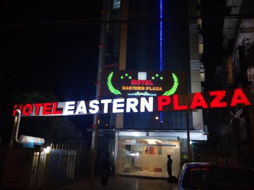 a sign for a hotel eastern plaza at night at Hotel Eastern Plaza in Kolkata