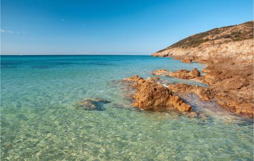 a view of the ocean with rocks in the water at Bilo 4 Premium in Foxiʼe Sali