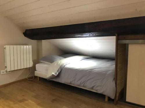 a large bed in a room with at Chaleureux studio cœur St Jean Bellecour in Lyon