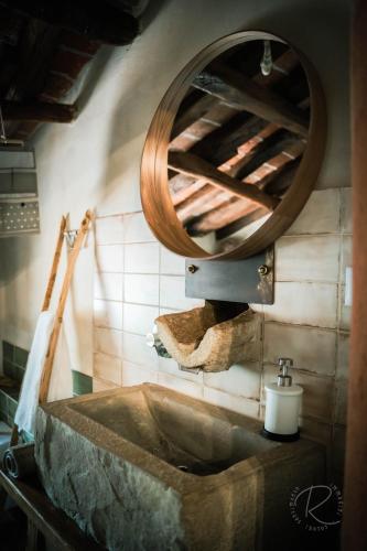 a bathroom with a sink and a mirror at Cascina Boschetto in Saliceto