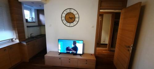 a television sitting on a dresser in a room at CityCenter in Belgrade