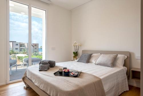 Cama o camas de una habitación en The Seashore - Residenze esclusive Vista Mare