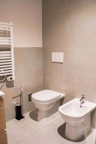a bathroom with a toilet and a sink at Terranova49 in Novara
