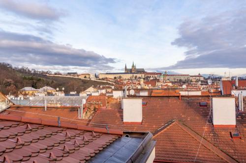 a view of a city from the roofs of buildings at Petrin Tower Residence in Prague