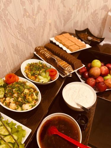 a table with plates of food and bowls of food at Adora Hotel in Istanbul