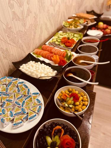 a buffet with many plates of food on a table at Adora Hotel in Istanbul
