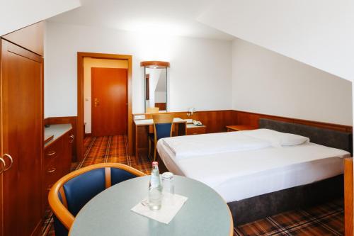Postel nebo postele na pokoji v ubytování Hotel Liebmann