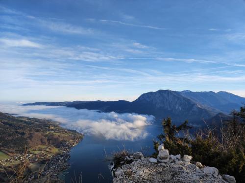 a view from the top of a mountain overlooking a lake at Hotel Aichingerwirt in Mondsee