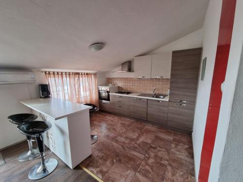 Kuchyň nebo kuchyňský kout v ubytování Apartments Nada