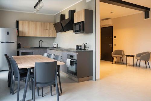 a kitchen and dining room with a table and chairs at Terranova49 in Novara