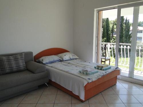 Postel nebo postele na pokoji v ubytování Apartmani Tepli Bok