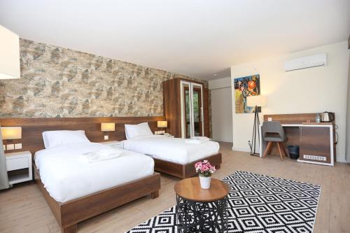 Säng eller sängar i ett rum på Avwan Hotel Çiğli