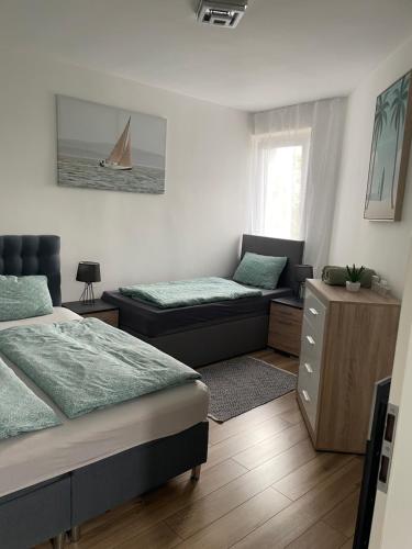 Posteľ alebo postele v izbe v ubytovaní Rózsadomb apartman