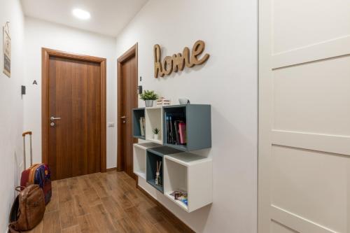 a room with white walls and a book shelf at Fornaci Vatican Flat in Rome