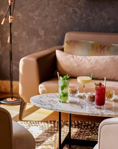 a living room with a table with drinks on it at Lara Barut Collection-Ultra All Inclusive in Lara