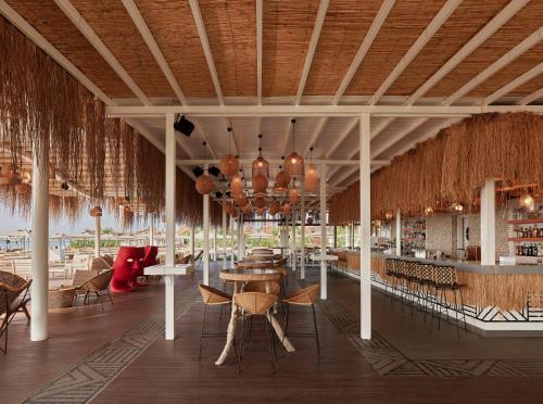 a rendering of a restaurant with tables and chairs at Lara Barut Collection-Ultra All Inclusive in Lara