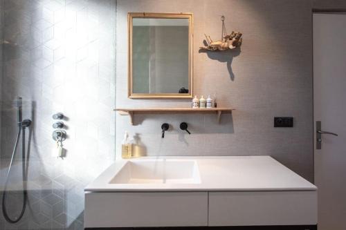 a bathroom with a sink and a mirror and a shower at #9 Opera's Duplex panoramic Sea View Terrace & AC 1min to Beach in Nice