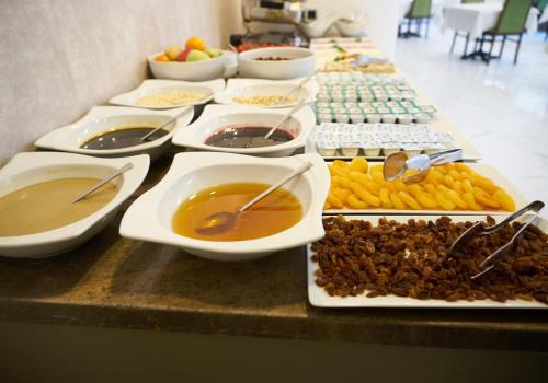 a buffet with many plates of food on a table at Mira Otel Alsancak in Izmir