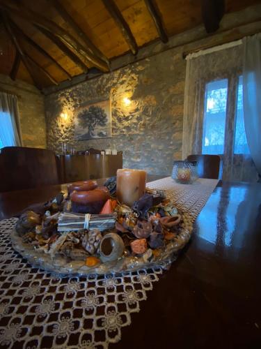 a plate of food on a table in a room at Το Πατρικό - To Patriko Epidavros in Ancient Epidavros