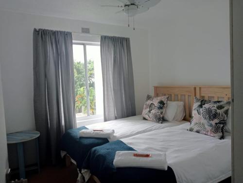 a bedroom with a large bed with a window at Laguna La Crete 163 in Margate