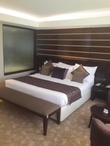 a bedroom with a large bed in a room at Boma Inn Eldoret in Eldoret