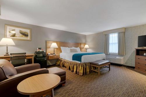 a hotel room with a bed and a couch at Best Western Plus Cold Spring in Plymouth