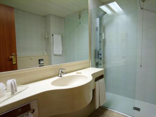 a bathroom with a sink and a shower at Best Western Park Hotel in Piacenza