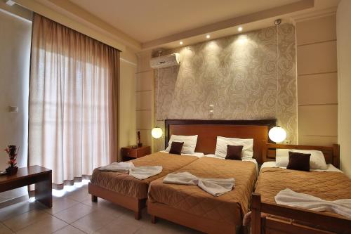 Posteľ alebo postele v izbe v ubytovaní Saint Amon Hotel