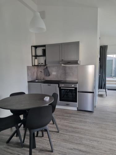 a kitchen with a table and chairs in a room at Ferienwohnung Euchen in Würselen