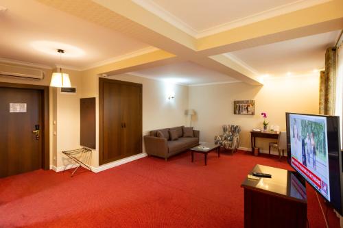 Телевизор и/или развлекательный центр в Hotel Art