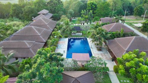 an aerial view of a resort with a swimming pool at Waterside Resort in Pran Buri